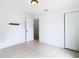 Bright bedroom features tile flooring, closet, and neutral walls at 4503 Courtland St, Tampa, FL 33610