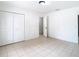 Bedroom with tile floors and closet at 4503 Courtland St, Tampa, FL 33610