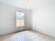 Bedroom with tile floors and a window at 4503 Courtland St, Tampa, FL 33610