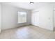 Bedroom with tile floors, a window and double closet at 4503 Courtland St, Tampa, FL 33610
