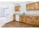 Well-lit kitchen featuring wood cabinets, granite countertops, and stainless steel appliances at 4503 Courtland St, Tampa, FL 33610