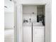 Laundry closet with washer, dryer, and water heater at 4503 Courtland St, Tampa, FL 33610