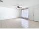 Spacious living room with tiled floors, ceiling fan and natural light at 4503 Courtland St, Tampa, FL 33610
