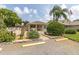Clubhouse entrance with parking sign, landscaping, and well-maintained surroundings at 4557 Glen Holw, New Port Richey, FL 34653