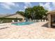 Community pool with lounge chairs and large brick patio area at 4557 Glen Holw, New Port Richey, FL 34653