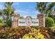 Entrance to the 'Briar Patch' community with attractive landscaping and a decorative sign at 4557 Glen Holw, New Port Richey, FL 34653