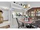 Cozy dining area with a wooden table and view into the kitchen at 4557 Glen Holw, New Port Richey, FL 34653