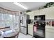 Bright kitchen featuring stainless steel appliances, eat in space, and ample natural light from nearby window at 4557 Glen Holw, New Port Richey, FL 34653