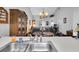 Enjoy this open concept kitchen providing ample counter space with stainless steel sink and views into dining area at 4557 Glen Holw, New Port Richey, FL 34653