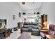 Comfortable living area featuring a sofa, side chair and shelving at 4557 Glen Holw, New Port Richey, FL 34653