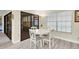 Cozy breakfast nook with sliding glass doors and natural light filtering through the windows at 4841 Wakefield Ct # 4841, New Port Richey, FL 34655
