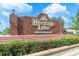 Entrance to Heritage Lake, a deed-restricted 55+ community, with brick monument and signage at 4841 Wakefield Ct # 4841, New Port Richey, FL 34655
