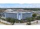 Stunning condo building featuring waterfront views, a circular drive and lush landscaping at 4939 Floramar Ter # 611, New Port Richey, FL 34652