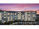 Stately condo building with waterfront marina, mature landscaping, and private parking at 4939 Floramar Ter # 611, New Port Richey, FL 34652