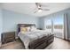 Comfortable bedroom featuring a king bed, light blue walls, and a view of the marina at 4939 Floramar Ter # 611, New Port Richey, FL 34652