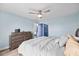 Stylish main bedroom with a king bed, contemporary furnishings, and calming blue walls at 4939 Floramar Ter # 611, New Port Richey, FL 34652