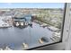 Wide water view with several boats docked at the marina. Daytime shot from the home's window at 4939 Floramar Ter # 611, New Port Richey, FL 34652