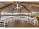 Covered pavilion with a ceiling fan has views of the harbor and tables for outdoor dining at 4939 Floramar Ter # 611, New Port Richey, FL 34652