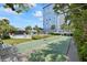 Outdoor shuffleboard court with view of building and pool at 4939 Floramar Ter # 611, New Port Richey, FL 34652