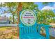 Sign states: 'Private Beach Club Members Only' with a palm tree and bamboo design elements at 4939 Floramar Ter # 611, New Port Richey, FL 34652