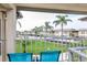 Enjoy the serene balcony view overlooking lush landscaping and community surroundings at 5123 Topaz Ln # 206, New Port Richey, FL 34652