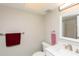 Bathroom featuring a modern sink, toilet, and storage space at 5123 Topaz Ln # 206, New Port Richey, FL 34652