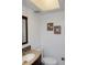 Half-bath featuring sand dollar decor at 5123 Topaz Ln # 206, New Port Richey, FL 34652