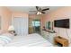 Bedroom with a ceiling fan and access to an outdoor balcony at 5123 Topaz Ln # 206, New Port Richey, FL 34652
