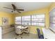 Inviting sunroom with a table, chairs, and a comfortable seating area at 5123 Topaz Ln # 206, New Port Richey, FL 34652