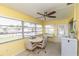 Cozy sunroom with natural light, table and chairs, perfect for relaxing and entertaining at 5123 Topaz Ln # 206, New Port Richey, FL 34652