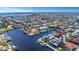 Stunning aerial view of an upscale neighborhood with multiple canals, offering a glimpse of luxurious waterfront living at 5145 Porpoise Pl, New Port Richey, FL 34652