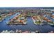 This aerial view shows a beautiful neighborhood surrounded by water, showcasing waterfront living at its finest at 5145 Porpoise Pl, New Port Richey, FL 34652