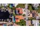 Overhead view of waterfront homes with private docks, pools, and solar panels on terracotta tile roofs at 5145 Porpoise Pl, New Port Richey, FL 34652