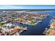 Stunning aerial view of waterfront homes with private docks and boat lifts on interconnected canals near the bay at 5145 Porpoise Pl, New Port Richey, FL 34652