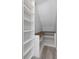 Custom closet with built-in shelving and desk, offering ample storage and workspace at 5145 Porpoise Pl, New Port Richey, FL 34652