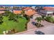 Charming single-Gathering home featuring a terracotta tile roof, a paver driveway, and a lush green lawn at 5145 Porpoise Pl, New Port Richey, FL 34652