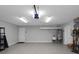 A clean, spacious garage with ample storage, an epoxy floor, utility sink, and an automatic door opener at 5145 Porpoise Pl, New Port Richey, FL 34652