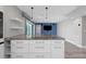 Spacious kitchen island with a marble countertop, complete with a wine rack, set within an open-concept design at 5145 Porpoise Pl, New Port Richey, FL 34652