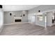Bright living room with fireplace, speakers and open floor plan offers modern comfort at 5145 Porpoise Pl, New Port Richey, FL 34652