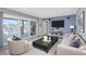 Living room with large sliding glass doors and view of waterfront at 5145 Porpoise Pl, New Port Richey, FL 34652
