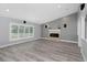 Spacious living room with fireplace and large windows, perfect for entertaining at 5145 Porpoise Pl, New Port Richey, FL 34652