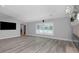 Light-filled living room featuring hardwood flooring and recessed lighting at 5145 Porpoise Pl, New Port Richey, FL 34652