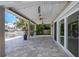 This covered patio provides a comfortable outdoor living space with ceiling fans and ample seating areas at 5145 Porpoise Pl, New Port Richey, FL 34652