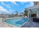 Beautiful pool and patio offer a serene outdoor space with stylish pavers, perfect for relaxation and recreation at 5145 Porpoise Pl, New Port Richey, FL 34652