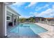 Enjoy a refreshing swim in this private pool, complete with a stylish patio and lush landscaping at 5145 Porpoise Pl, New Port Richey, FL 34652