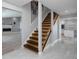 Modern staircase with stainless steel railings and wood steps at 5145 Porpoise Pl, New Port Richey, FL 34652