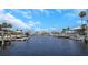 Scenic waterfront view of the canal with boats docked, showcasing the beautiful community at 5145 Porpoise Pl, New Port Richey, FL 34652