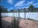 A backyard featuring a light-colored fence, a tiled patio, and a pergola at 5391 Pillar Ave, Spring Hill, FL 34608