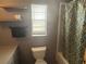 Bathroom featuring a toilet, bathtub, and vanity, with neutral tones at 5391 Pillar Ave, Spring Hill, FL 34608