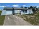 Charming single-story home with an attached garage and well-lit walkway at 5391 Pillar Ave, Spring Hill, FL 34608